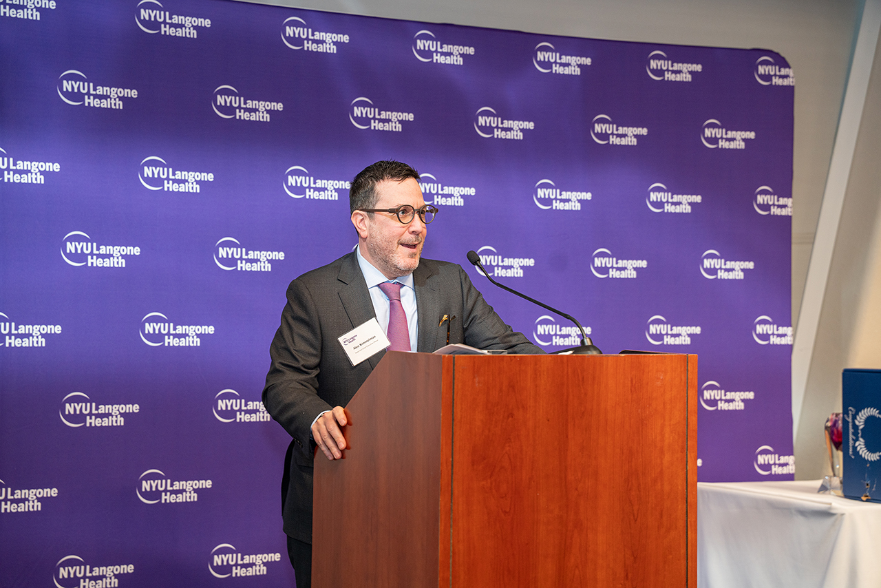 Dr. Alec Kimmel at the podium